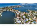 Wide aerial view showing the property and surrounding area at 405 Harbor S Dr, Indian Rocks Beach, FL 33785