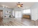 Bright living room featuring hardwood floors and a ceiling fan at 5125 Palm Springs Blvd # 2204, Tampa, FL 33647