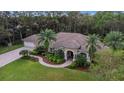 Single-Gathering home with tile roof, landscaping, and driveway at 1862 E Lake Woodlands Pkwy, Oldsmar, FL 34677