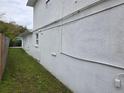 Side view of property showing the newly painted exterior and green, grassy area at 301 W Chelsea St, Tampa, FL 33603