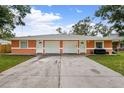 Two-unit building with attached garages at 3330 W Heiter St, Tampa, FL 33607