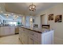 Modern kitchen with granite countertops and stainless steel appliances at 650 Island Way # 406, Clearwater Beach, FL 33767