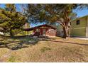 Charming single-story home with a cozy front porch, mature trees, and a well-maintained lawn at 7176 Westwind St, Weeki Wachee, FL 34607