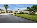 House exterior showcasing landscaping and driveway at 2739 Sherbrooke Ln # B, Palm Harbor, FL 34684