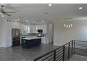 Modern kitchen with stainless steel appliances and a large island at 3915 W Robson St, Tampa, FL 33614