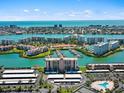 An aerial view of a waterfront community with lush landscaping and a marina at 7600 Sun Island S Dr # 107, South Pasadena, FL 33707