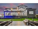 Waterfront property features a modern design with a pool, balcony, and dock for luxury living at 1954 Iowa Ne Ave, St Petersburg, FL 33703