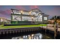 This waterfront home features modern design, a backyard pool, and a private dock for boaters at 1954 Iowa Ne Ave, St Petersburg, FL 33703
