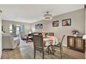 Inviting living room with hardwood floors, neutral walls, modern furniture and décor for a cozy and stylish space at 200 Glennes Ln # 111, Dunedin, FL 34698
