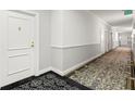 Building hallway with carpeted floors and neutral-colored walls at 345 Bayshore Blvd # 1104, Tampa, FL 33606