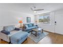 Living room with light blue couch and wood floor at 4715 Bay Ne St # 227, St Petersburg, FL 33703