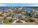 An aerial view showcasing the beautiful coastal community, waterfront access, pool, and charming neighborhood at 910 Oakwood Dr, Largo, FL 33770
