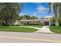 House exterior showcasing a ranch style home with a lawn at 1015 Snell Isle Ne Blvd, St Petersburg, FL 33704