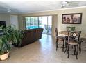 Spacious living room with comfortable seating and views to the pool at 212 Poinciana Ln, Largo, FL 33770