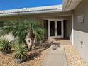 Front entry features double doors and a welcoming walkway at 212 Poinciana Ln, Largo, FL 33770