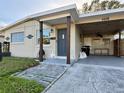 House exterior featuring a covered entryway and carport at 5018 Chancellor Ne St, St Petersburg, FL 33703