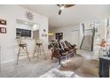 Spacious living room with high ceilings and a view of the kitchen at 902 Woodbridge Ct, Safety Harbor, FL 34695