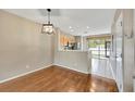 Bright dining area with hardwood floors and kitchen access at 10316 Estero Bay Ln, Tampa, FL 33625