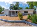 Well-maintained house with a landscaped yard and driveway at 1537 Excalibur St, Holiday, FL 34690