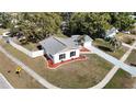 Aerial view of a house with a gray roof and landscaped yard at 6269 Skyline Ct, Spring Hill, FL 34606