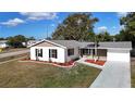 Aerial view of a charming house with a landscaped yard at 6269 Skyline Ct, Spring Hill, FL 34606