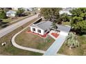 Aerial view of a house with a gray roof and landscaped yard at 6269 Skyline Ct, Spring Hill, FL 34606