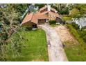 Aerial view of residential property, showcasing a house and yard at 715 S Himes Ave, Tampa, FL 33609
