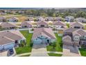 Aerial view of a house and neighborhood at 13444 Golden Lime Ave, Spring Hill, FL 34609