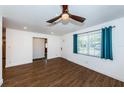 Bright living room with wood floors and ceiling fan at 1850 Maryland Ne Ave, St Petersburg, FL 33703