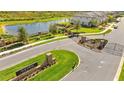 Gated community entrance with landscaping and signage at Haven at Meadow Pointe at 3632 Bellmeade Ct, Wesley Chapel, FL 33543