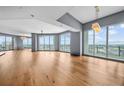 Luxury living room with hardwood floors and floor to ceiling windows at 449 S 12Th St # 2701, Tampa, FL 33602