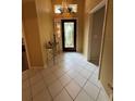 Bright entryway with tile floors and stained-glass door at 1404 Woodstream Dr, Oldsmar, FL 34677