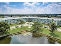 Aerial view of the Oasis community, showcasing its buildings, landscaping, and waterfront location at 1900 59Th N Ave # 305, St Petersburg, FL 33714