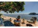 Waterfront patio with seating at 5400 Aloha Dr, St Pete Beach, FL 33706