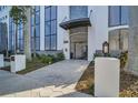 Beautiful building entrance with decorative iron gate, manicured landscaping, and modern lighting at 226 5Th N Ave # 706, St Petersburg, FL 33701