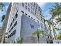 Modern building exterior with a large 'W' logo, sleek design, palm trees, and a contemporary facade at 226 5Th N Ave # 706, St Petersburg, FL 33701