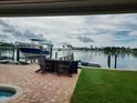 Tranquil dockside view with boat and seating area at 16126 4Th E St, Redington Beach, FL 33708