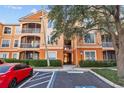 Condo building exterior with landscaping and parking at 5000 Culbreath Key Way # 4-206, Tampa, FL 33611