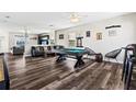 Game room with pool table, air hockey, and comfortable seating at 5434 Sandy Shell Dr, Apollo Beach, FL 33572