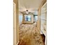 Spacious living room with carpeted floors and built-in shelves at 1910 E Palm Ave # 13102, Tampa, FL 33605