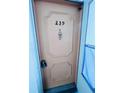 Condo building's front door, numbered 239, with a simple design at 2060 Marilyn St # 239, Clearwater, FL 33765