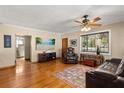 Spacious living room with hardwood floors and leather furniture at 4237 Dr Martin Luther King Jr N St, St Petersburg, FL 33703