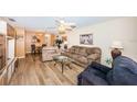 Living room with light brown couch and wood floors at 5969 Terrace Park N Dr # 309, St Petersburg, FL 33709