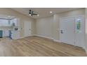 Bright living room with new flooring, recessed lighting, and ceiling fan at 604 Angelica Pl, Brandon, FL 33510