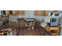 Kitchen with wood cabinets needs updating. Shows signs of water damage at 7054 Hibiscus S Ave, South Pasadena, FL 33707