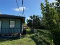 Side view of house showcasing backyard and shed at 847 Hand Ave, Sarasota, FL 34232