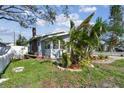 Side view of the house showing additional landscaping and a shed at 1757 New Hampshire Ne Ave, St Petersburg, FL 33703