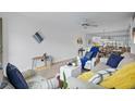Open concept living room with coastal decor at 5720 13Th N Ave # 203B, St Petersburg, FL 33710