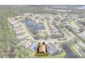 Aerial view of a single Gathering home on a residential street at 10097 Holly Berry Dr, Weeki Wachee, FL 34613