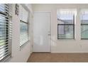 Bright sunroom with tile floors and window blinds at 37820 Alissa Dr, Zephyrhills, FL 33542